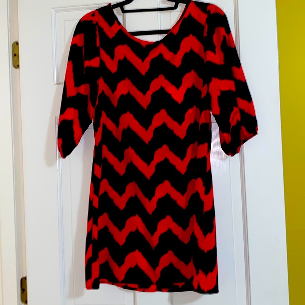 Brand new dress with tags. Red and black. Bow on back. Size medium.